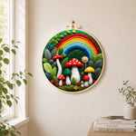Forest rainbow and red mushrooms needle felt wall art displayed in a bright home interior