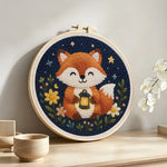 Fox at night punch needle artwork displayed on a table