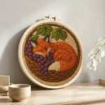 Fox in the basket punch needle artwork displayed on a table