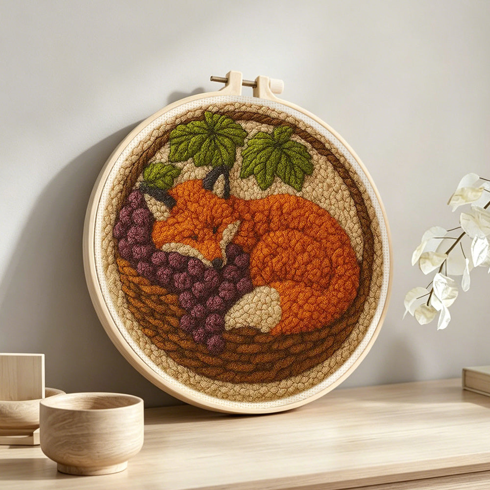 Fox in the basket punch needle artwork displayed on a table