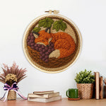 Finished fox in the basket artwork displayed on a wall