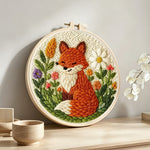 Fox in the flowers punch needle artwork displayed on a table