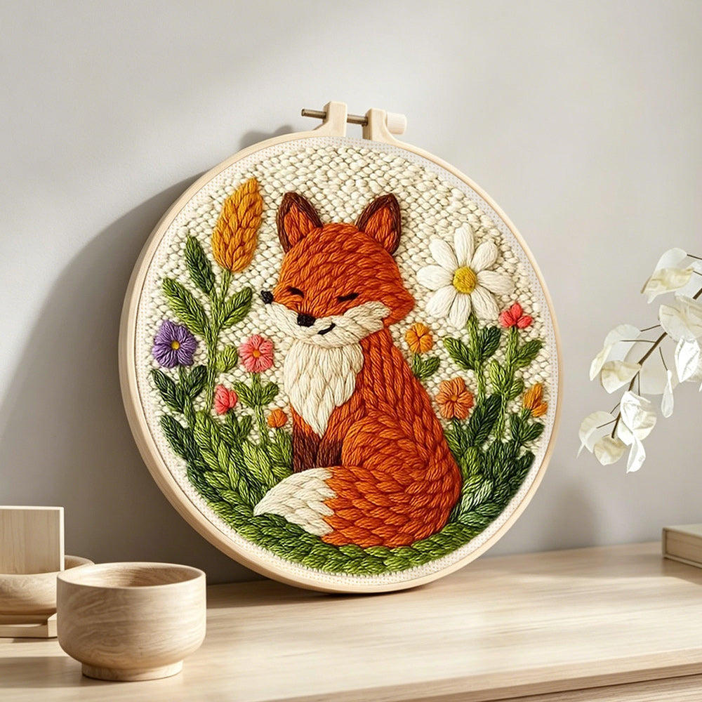 Fox in the flowers punch needle artwork displayed on a table