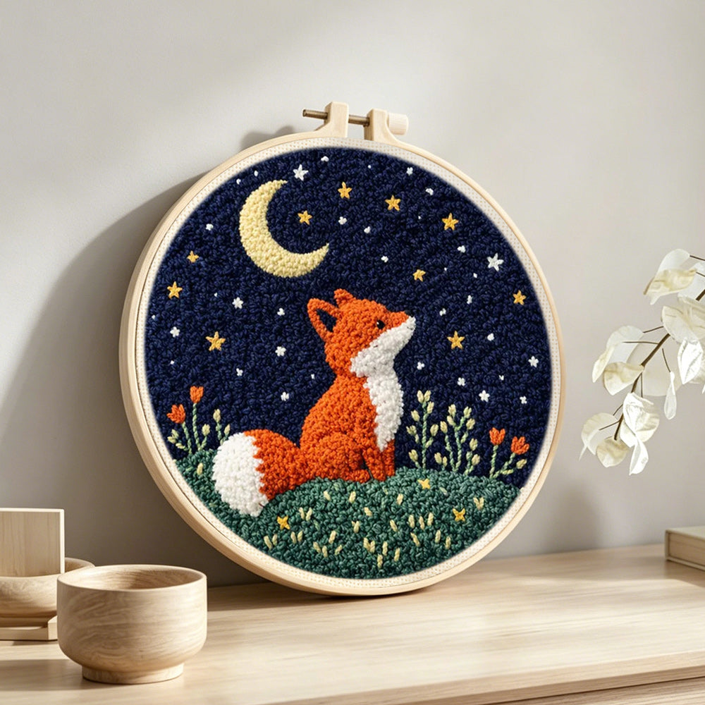 Fox under the moon punch needle artwork displayed on a table