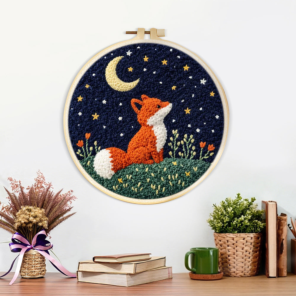 Finished fox under the moon artwork displayed on a wall