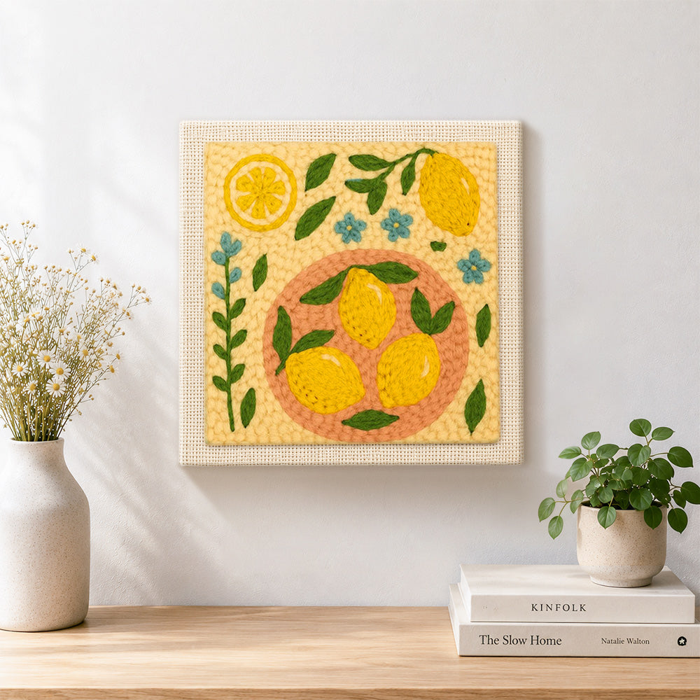 Finished fresh lemons and little blue flowers artwork displayed on a wall