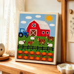 Fun farmyard animals and pumpkin season punch needle artwork displayed on a table