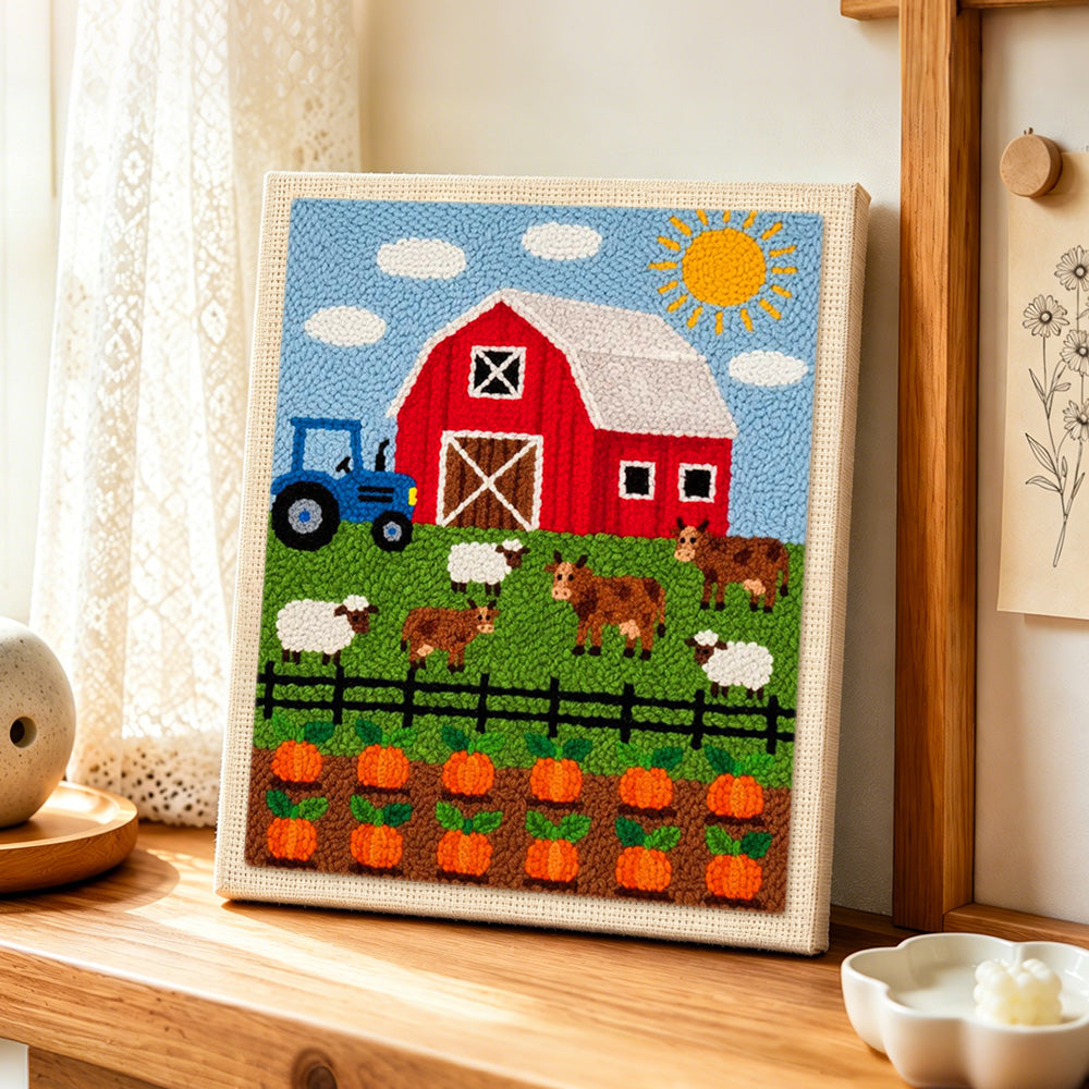 Fun farmyard animals and pumpkin season punch needle artwork displayed on a table