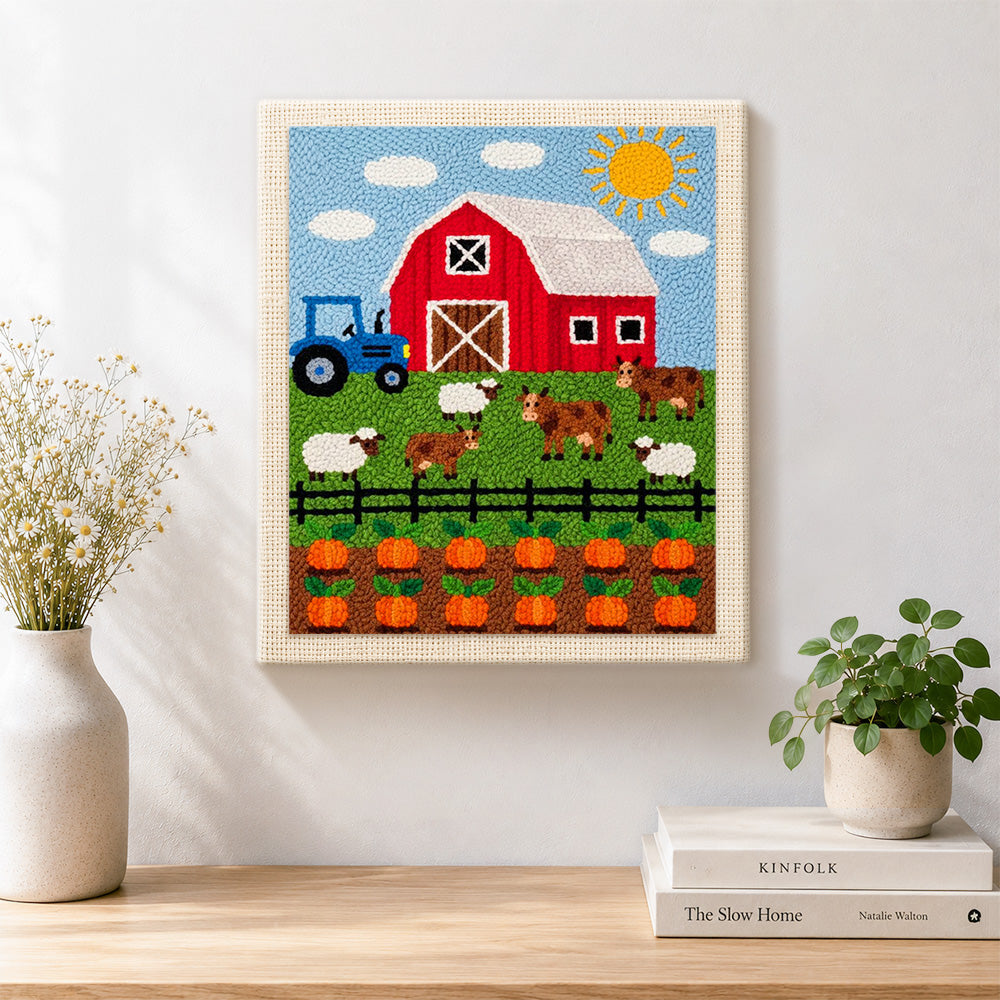 Finished fun farmyard animals and pumpkin season artwork displayed on a wall