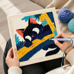 Creating handmade funny black cat on a branch punch needle artwork