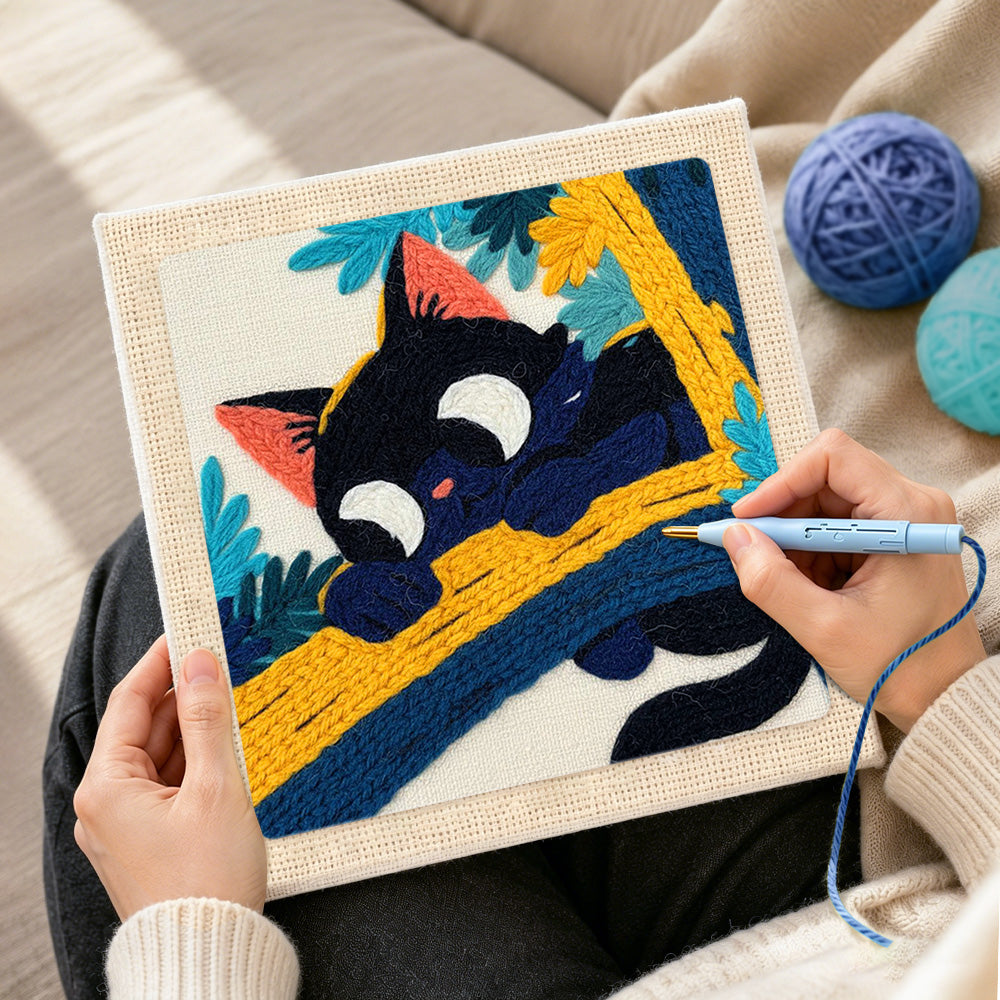 Creating handmade funny black cat on a branch punch needle artwork