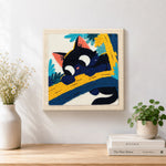 Finished funny black cat on a branch artwork displayed on a wall