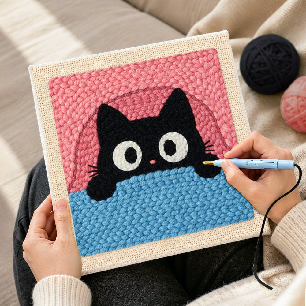 Creating handmade funny peeking kitten punch needle artwork