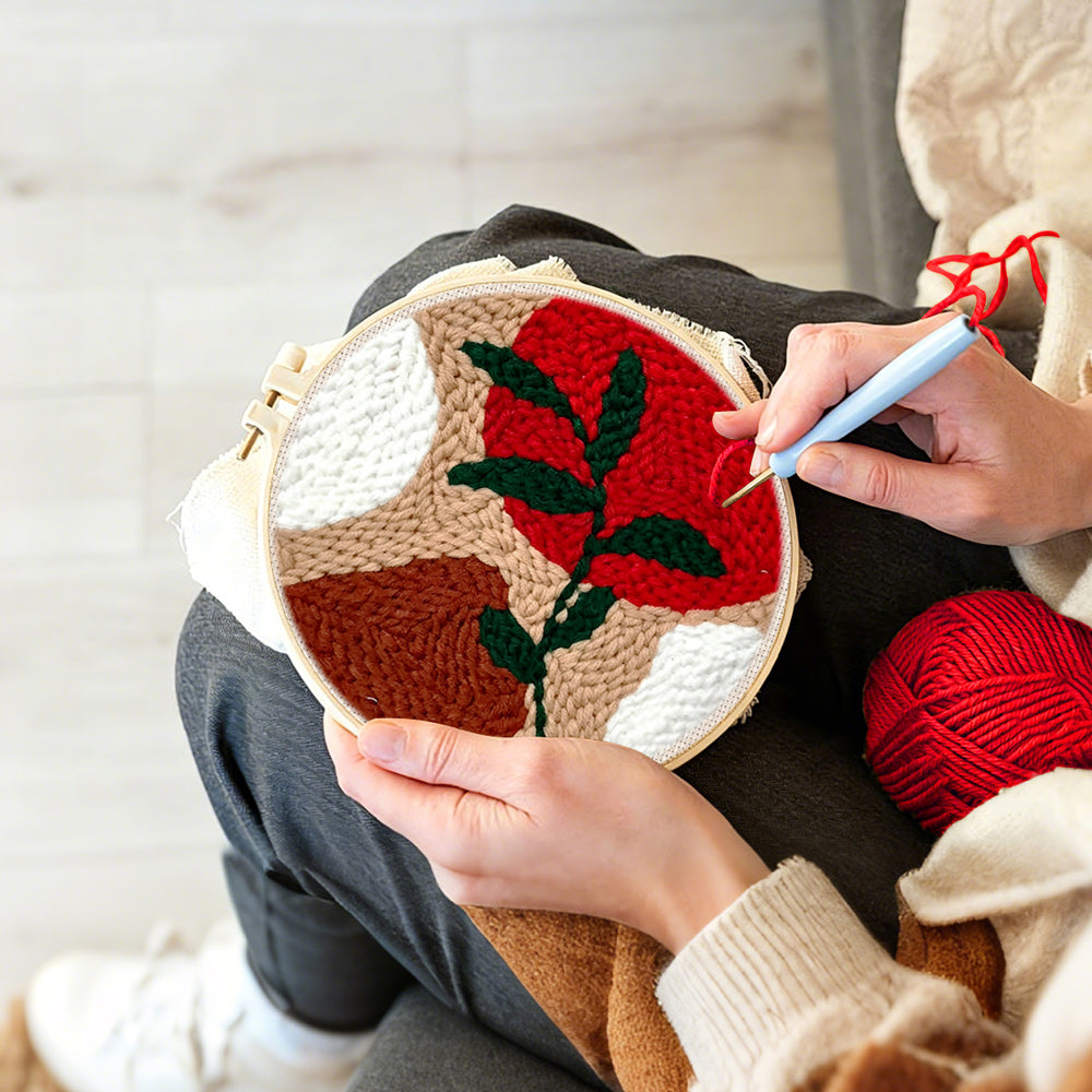 Creating handmade geometric colour block with green vine punch needle artwork