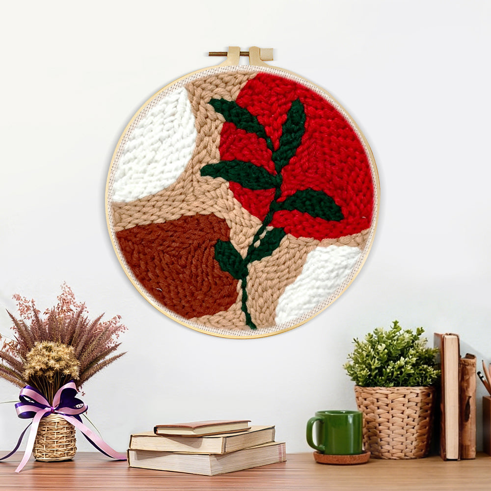 Finished geometric colour block with green vine artwork displayed on a wall