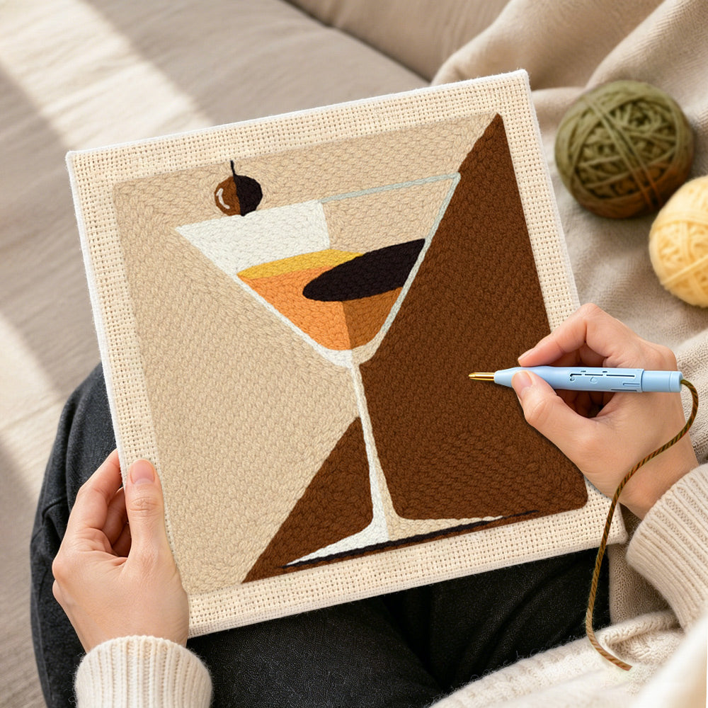 Creating handmade geometric martini with olive punch needle artwork