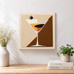Finished geometric martini with olive artwork displayed on a wall