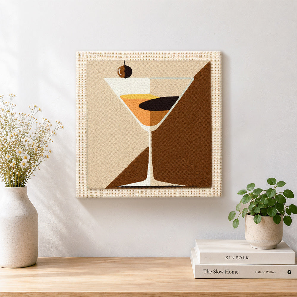 Finished geometric martini with olive artwork displayed on a wall