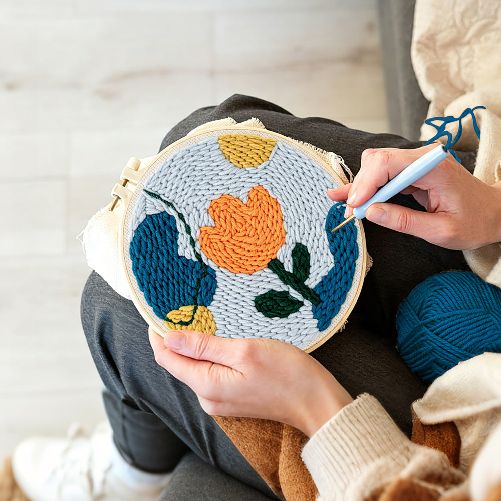 Creating handmade geometric orange tulip punch needle artwork