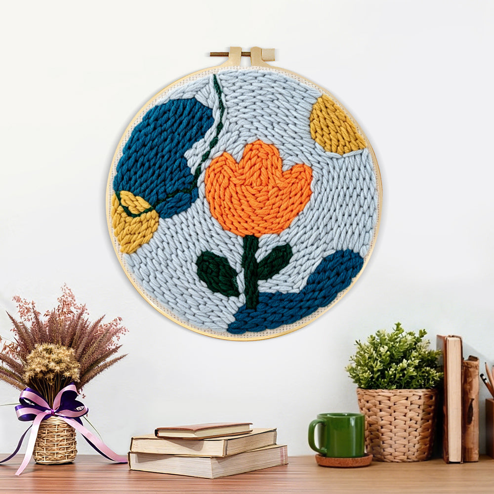 Finished geometric orange tulip artwork displayed on a wall