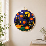 Giant black cat and spooky halloween pumpkins needle felt wall art displayed in a bright home interior