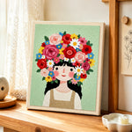 Giant floral crown girl punch needle artwork displayed on a table