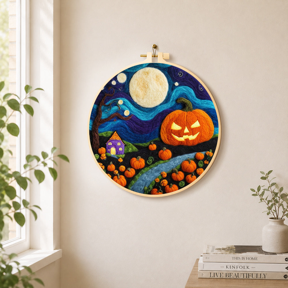 Giant pumpkin on halloween night needle felt wall art displayed in a bright home interior