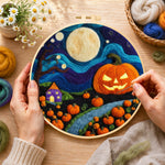 Creating the giant pumpkin on halloween night wool painting by hand with a felting needle