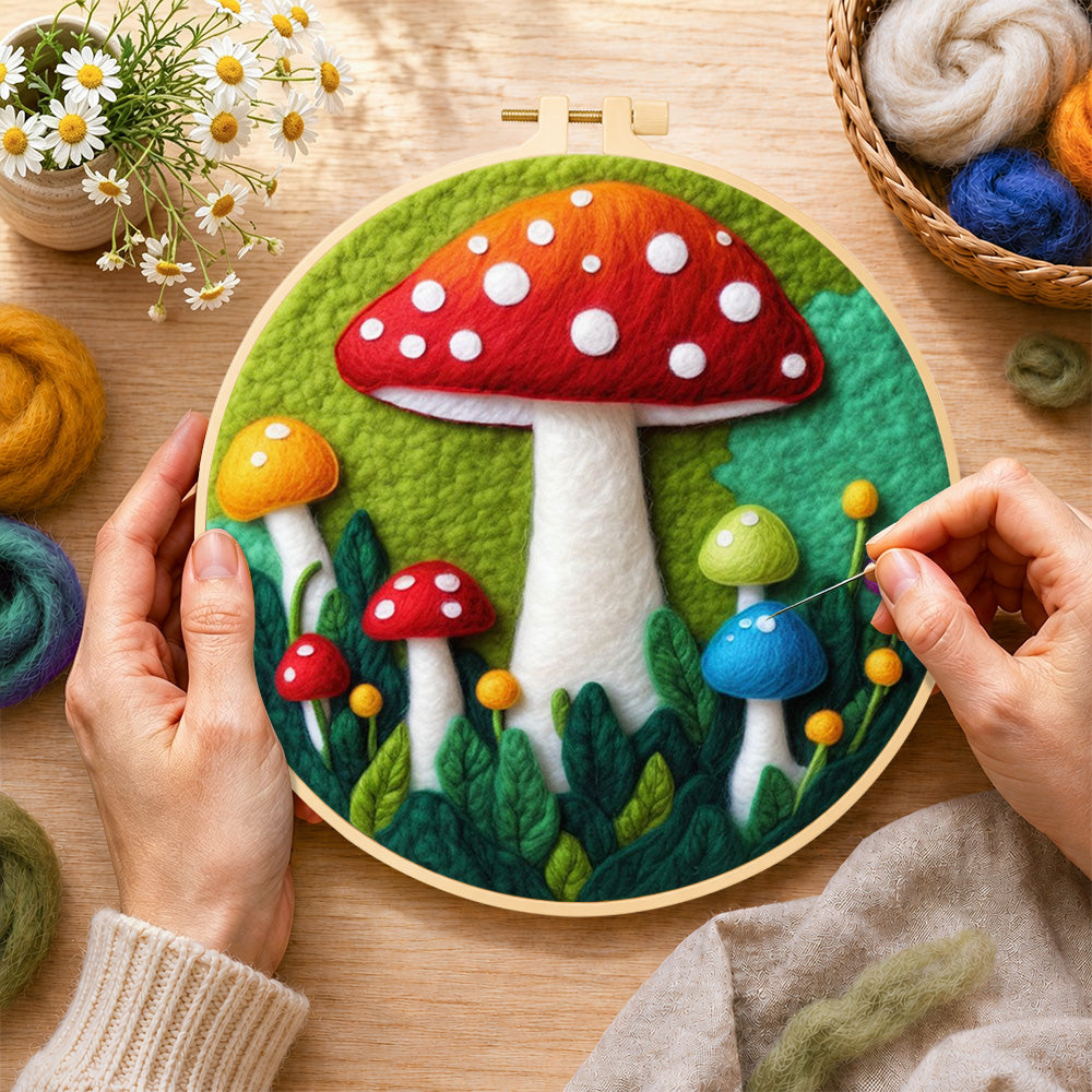 Creating the giant red mushroom in leaves wool painting by hand with a felting needle