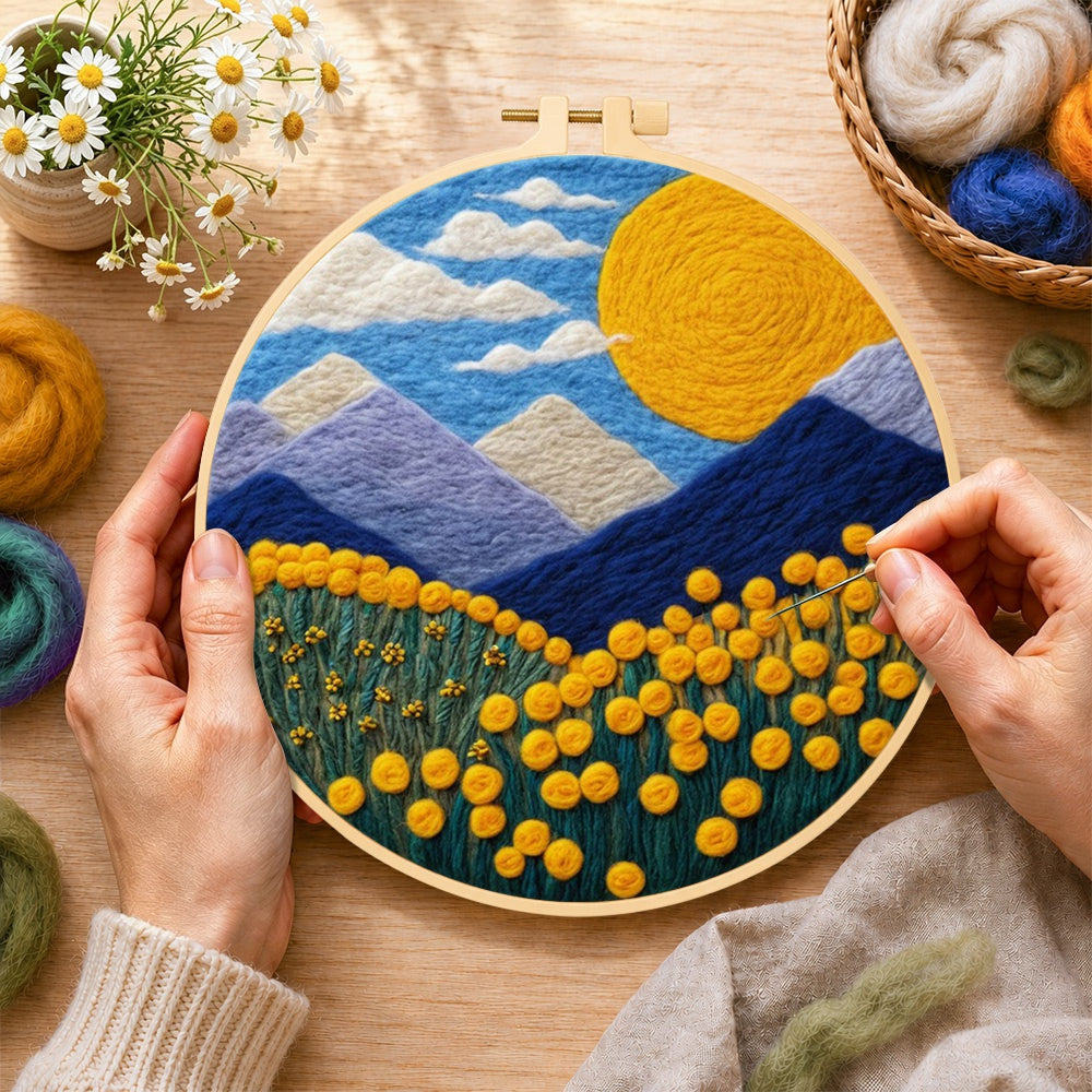 Creating the giant sun, mountains and yellow flowers wool painting by hand with a felting needle