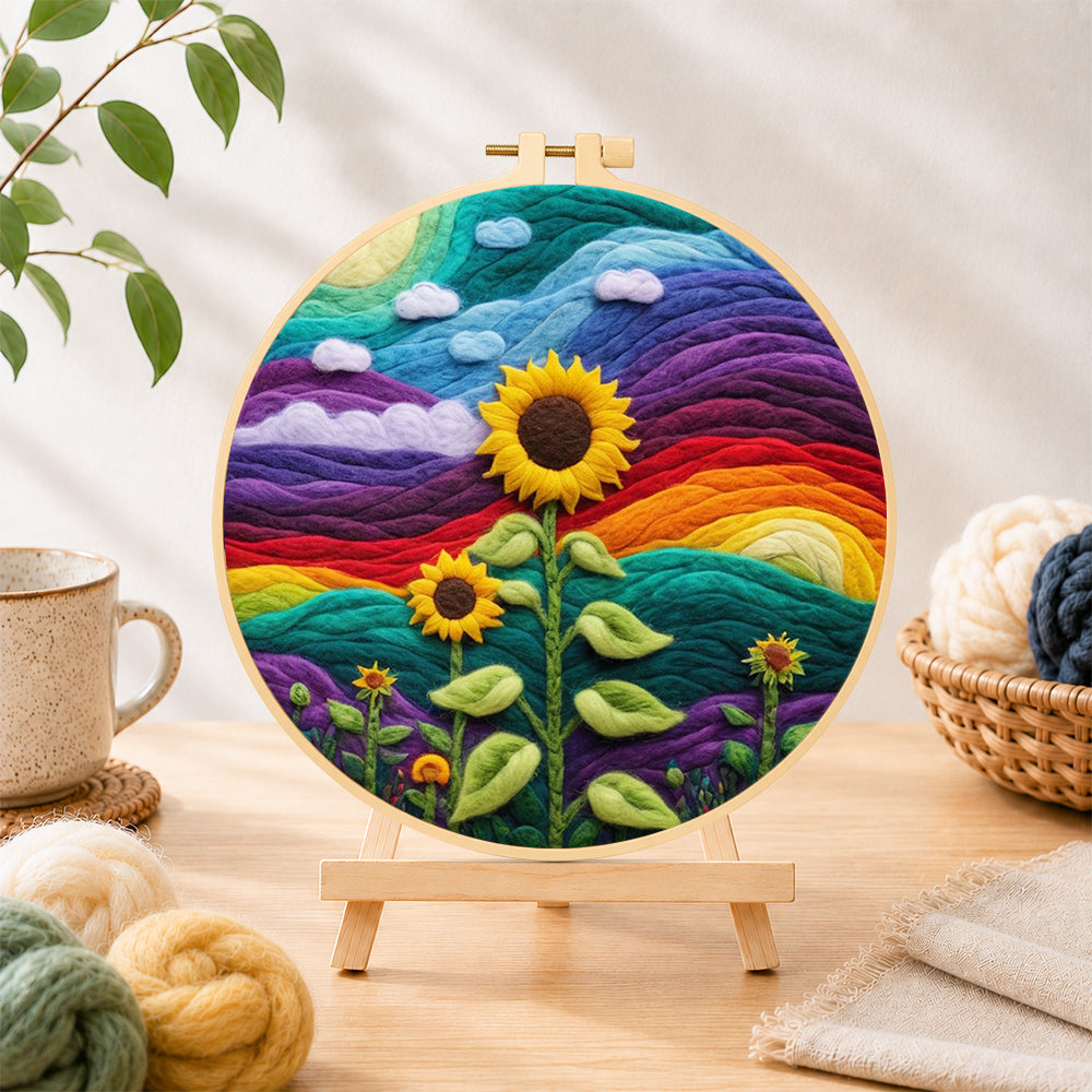 Finished giant sunflower on rainbow hills needle felting displayed on a wooden easel