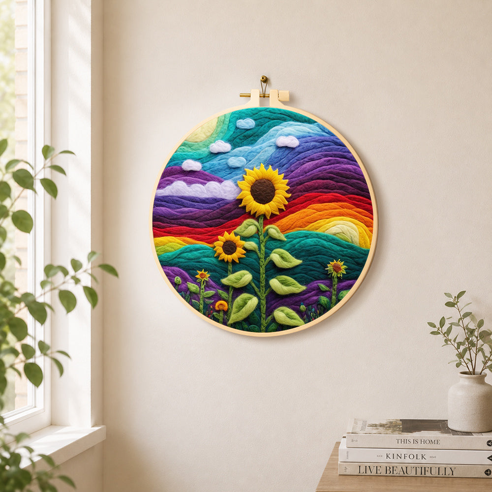 Giant sunflower on rainbow hills needle felt wall art displayed in a bright home interior