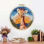 Finished giraffe at sunset artwork displayed on a wall