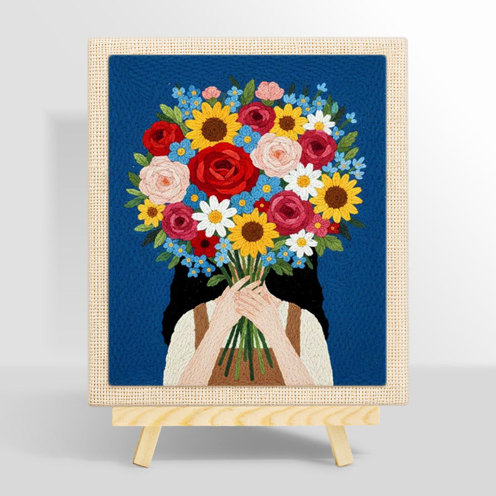 Girl holding giant flower bunch punch needle kit for beginners