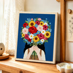 Girl holding giant flower bunch punch needle artwork displayed on a table
