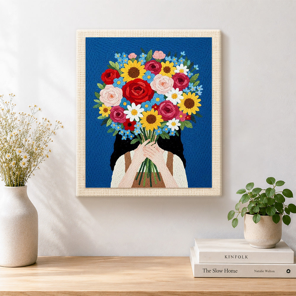 Finished girl holding giant flower bunch artwork displayed on a wall