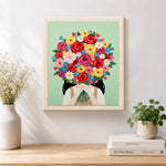 Finished girl with bright flower bouquet artwork displayed on a wall