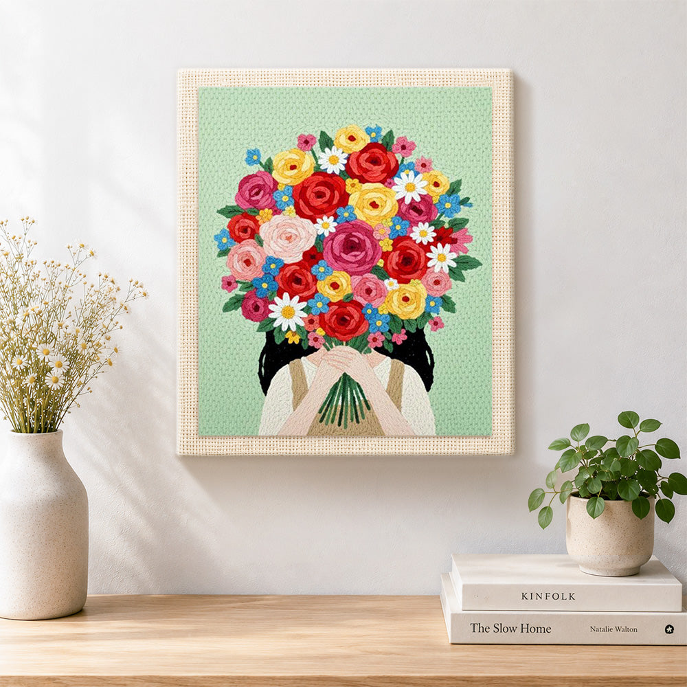 Finished girl with bright flower bouquet artwork displayed on a wall