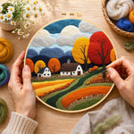 Creating the golden autumn tree and rolling hills wool painting by hand with a felting needle