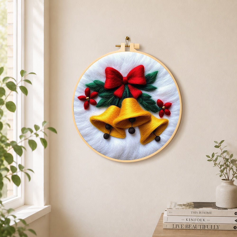 Golden christmas bells with red bow needle felt wall art displayed in a bright home interior
