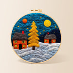 Golden christmas tree and snowy cabins needle felting kit for beginners with a round wooden frame