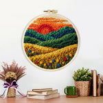 Finished golden field and green hills at sunset artwork displayed on a wall