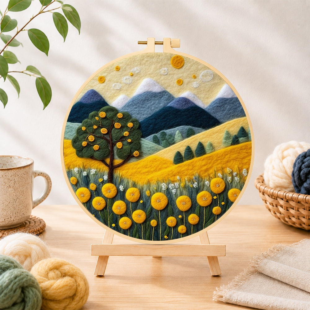 Finished golden harvest tree and mountains needle felting displayed on a wooden easel
