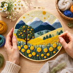 Creating the golden harvest tree and mountains wool painting by hand with a felting needle