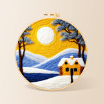 Golden sun and blue mountain snowscape needle felting kit for beginners with a round wooden frame