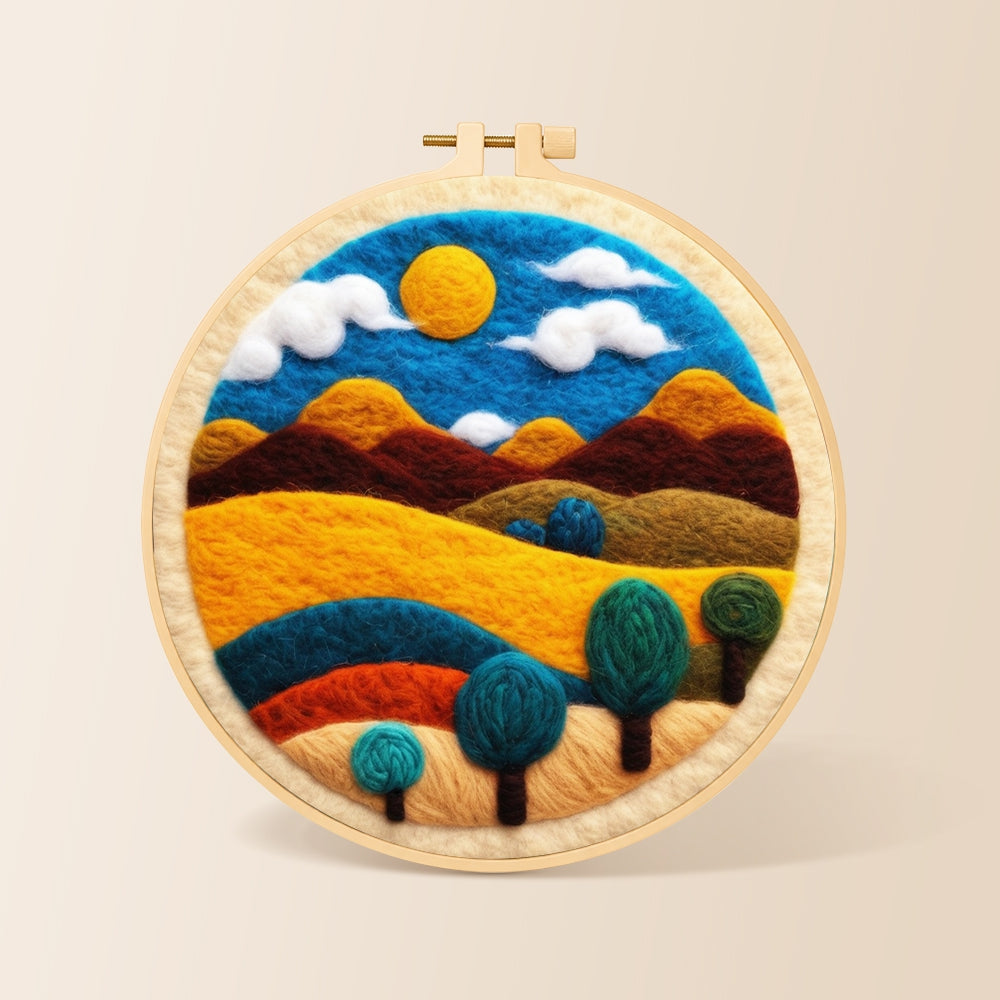 Golden sun and swirling tree hills needle felting kit for beginners with a round wooden frame