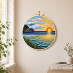 Golden sunset and textured rolling waves needle felt wall art displayed in a bright home interior