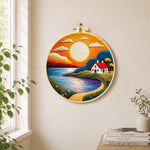 Golden sunset and tranquil lake needle felt wall art displayed in a bright home interior