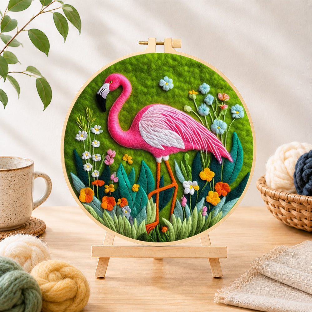 Finished graceful pink flamingo and wildflowers needle felting displayed on a wooden easel