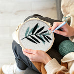 Creating handmade green fern leaf punch needle artwork